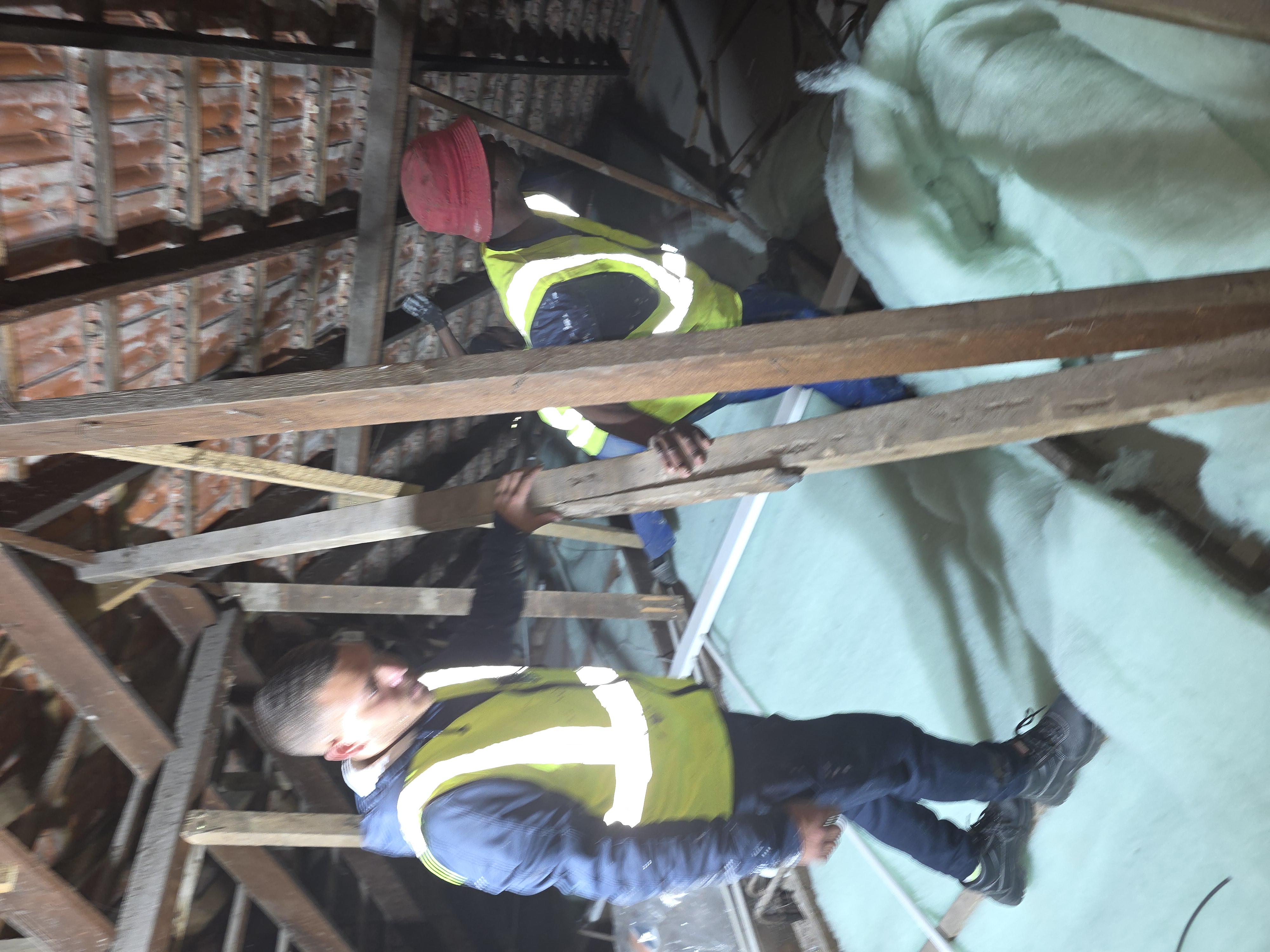Roberts Roofing completing ceiling and insulation work